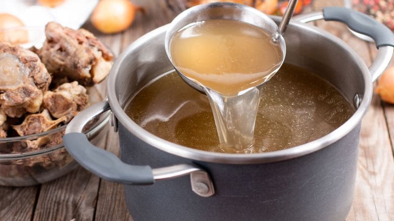 chicken bone broth cooking in a pot
