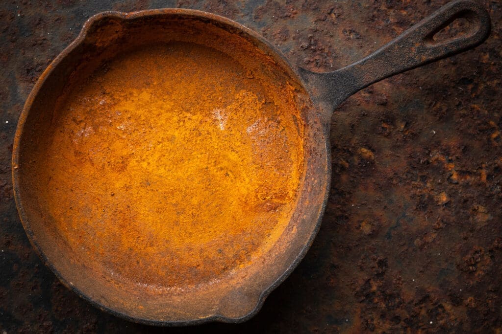 An old rusted cast iron skillet that wasn't cleaned or seasoned properly. Cleaning a cast iron skillet the right way helps preserve it. 